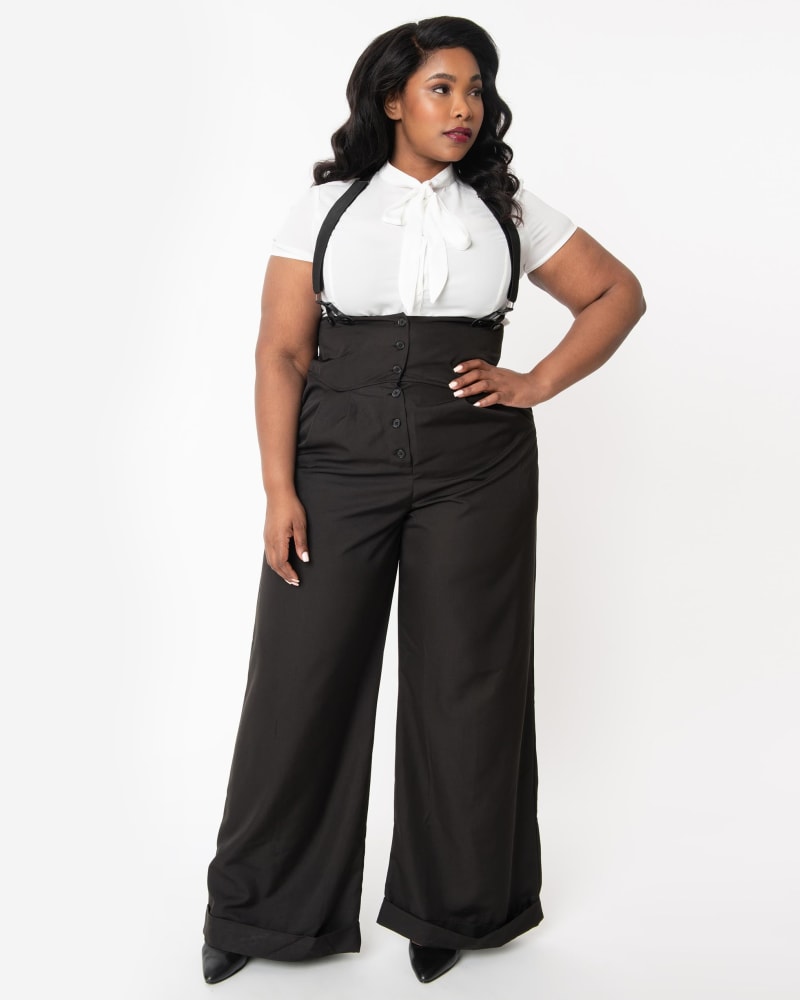 Front of a model wearing a size 5X/26 Unique Vintage Plus Size Black Thelma Suspender Pants in Black by Unique Vintage. | dia_product_style_image_id:269968